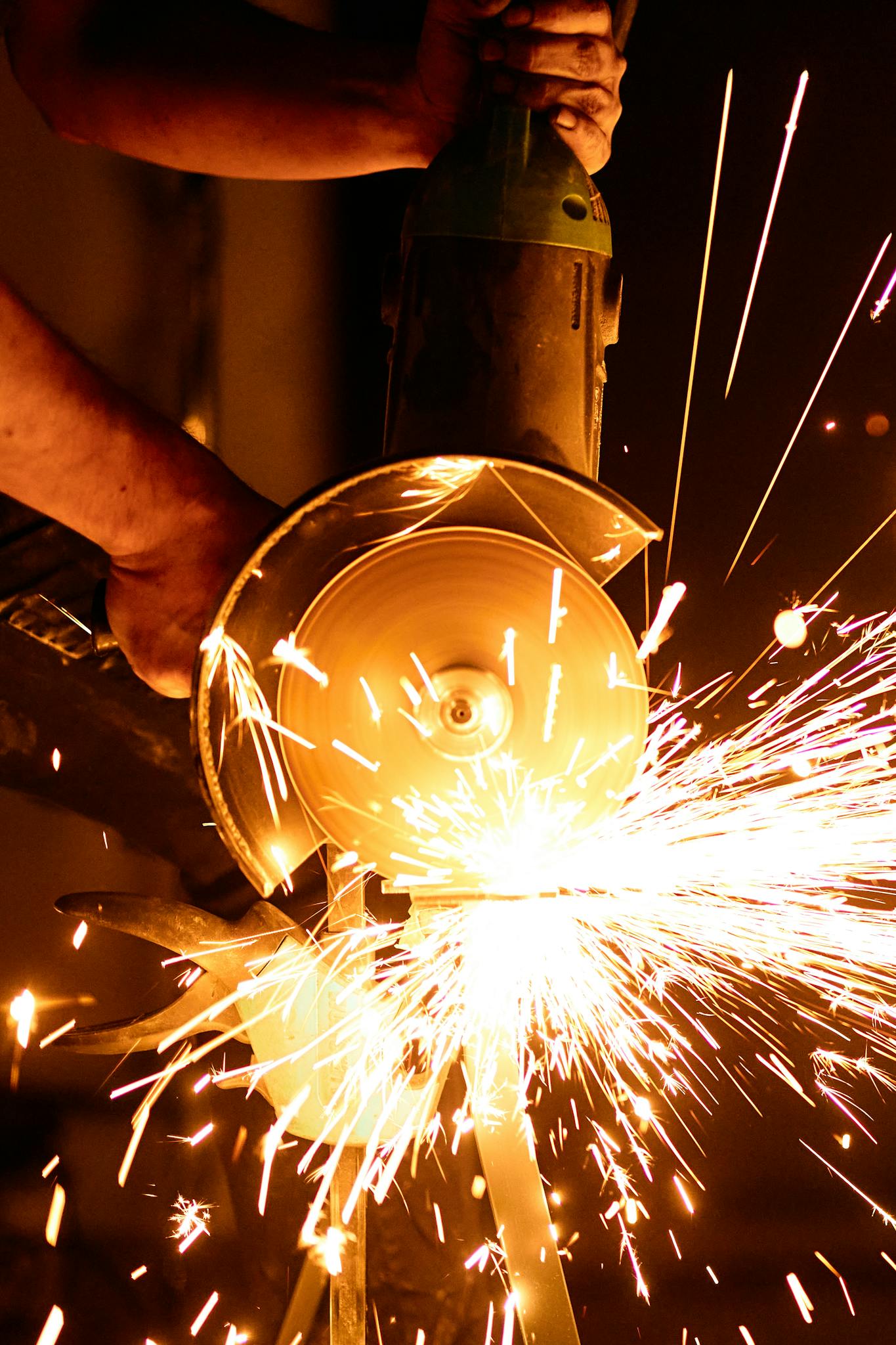 Angle grinder in action with vibrant sparks, showcasing industrial power tool dynamics.
