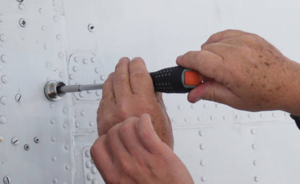 A man screwing by using a tool